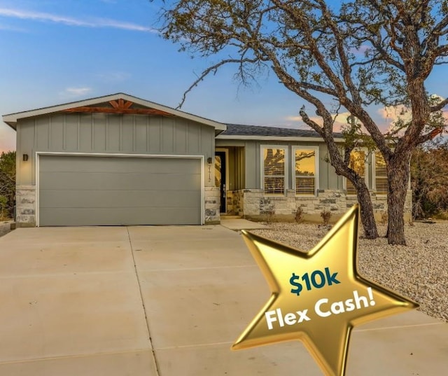 ranch-style house featuring a garage