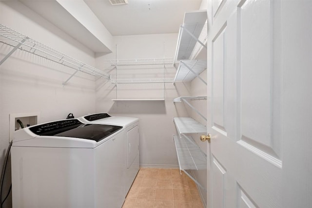 clothes washing area featuring washing machine and clothes dryer