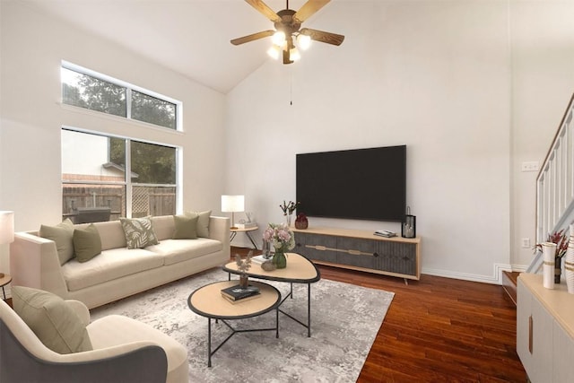 living room featuring dark hardwood / wood-style floors, ceiling fan, and high vaulted ceiling