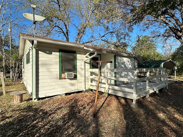 view of side of home featuring cooling unit