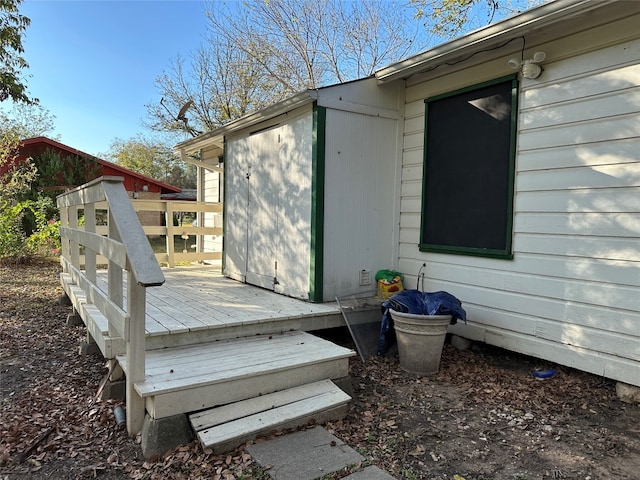 deck featuring a storage shed