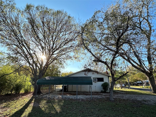 view of side of home featuring a carport