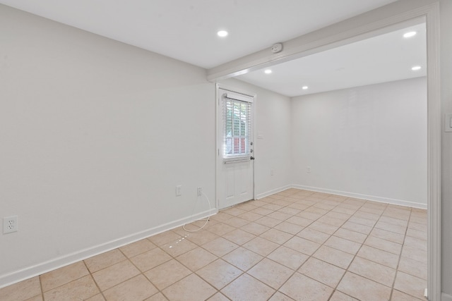 empty room with light tile patterned floors