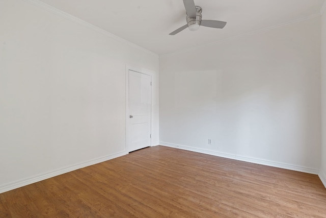 spare room featuring light wood-type flooring, ceiling fan, and crown molding