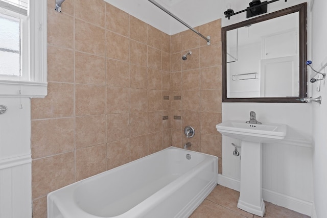 bathroom with tile patterned floors and tiled shower / bath combo