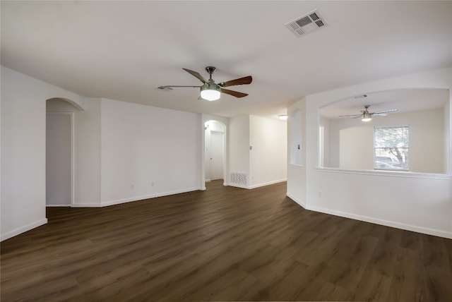 spare room with dark hardwood / wood-style floors and ceiling fan