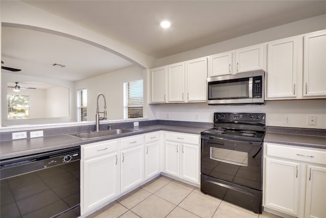 kitchen featuring white cabinetry, a healthy amount of sunlight, and black appliances