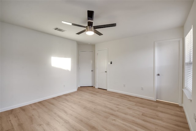 unfurnished room with ceiling fan and light hardwood / wood-style flooring