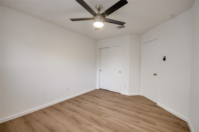 unfurnished bedroom featuring light hardwood / wood-style flooring and ceiling fan