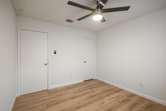 unfurnished bedroom featuring ceiling fan and light hardwood / wood-style flooring