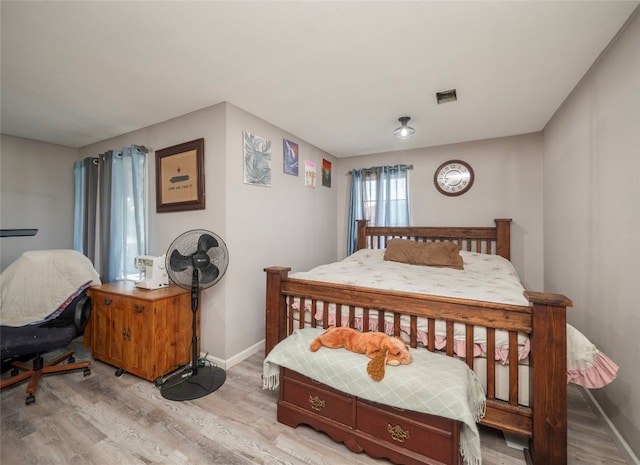 bedroom featuring light wood-type flooring