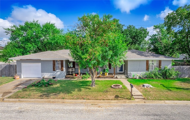 single story home featuring a garage and a front lawn