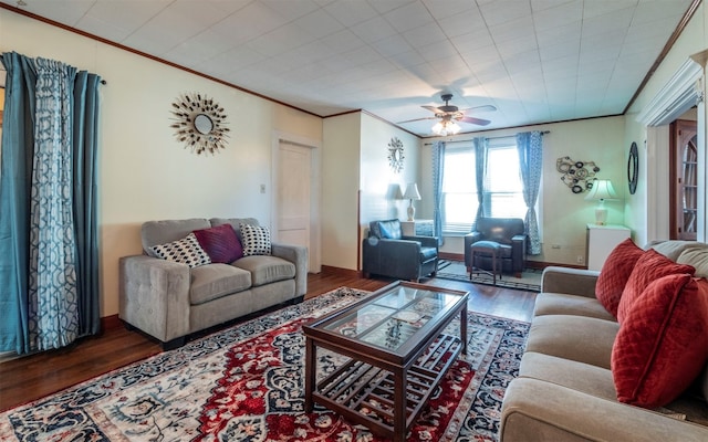 living room featuring crown molding, dark hardwood / wood-style flooring, and ceiling fan