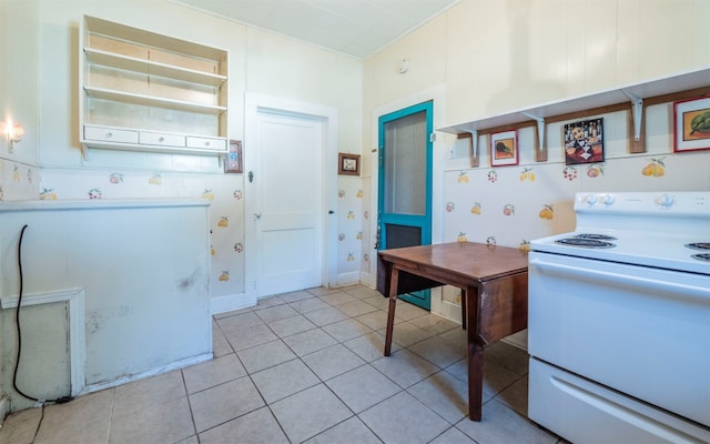 kitchen featuring white range with electric cooktop and light tile patterned floors