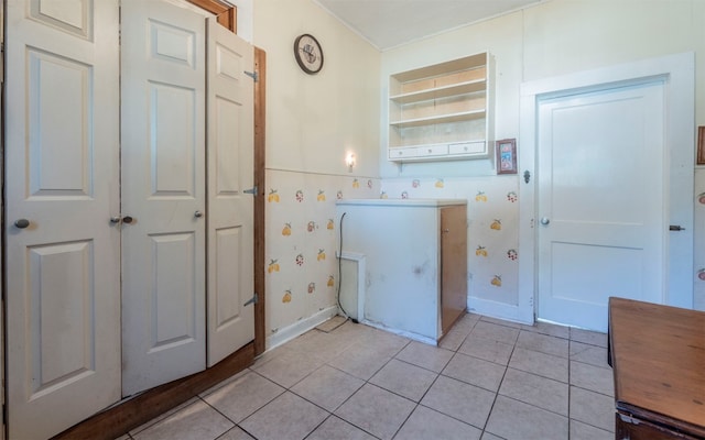 washroom with light tile patterned floors