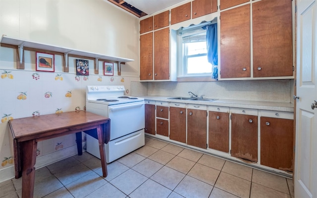 kitchen featuring electric stove, decorative backsplash, sink, and light tile patterned floors