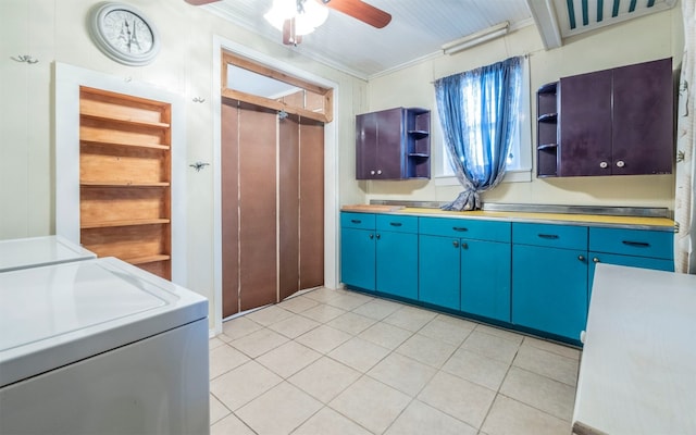 kitchen with light tile patterned floors, ceiling fan, crown molding, and washing machine and clothes dryer