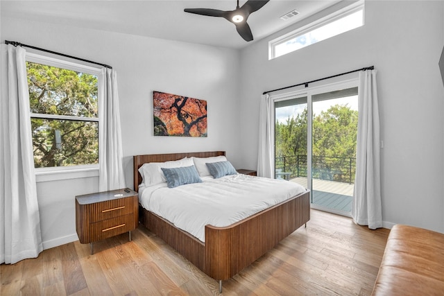 bedroom with ceiling fan, light hardwood / wood-style floors, and access to exterior