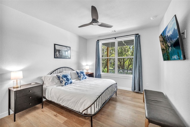 bedroom with ceiling fan and light wood-type flooring