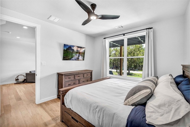 bedroom featuring light hardwood / wood-style floors and ceiling fan