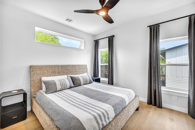 bedroom featuring light wood-type flooring and ceiling fan