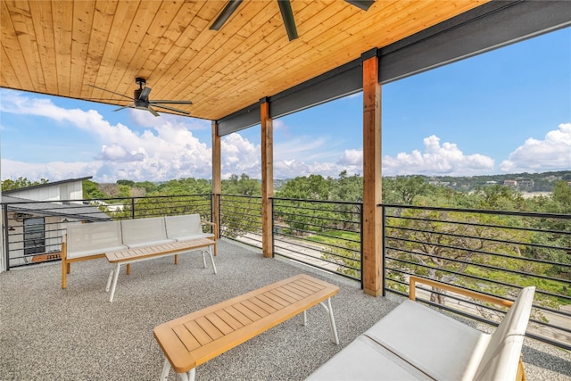 view of patio featuring an outdoor living space and a balcony