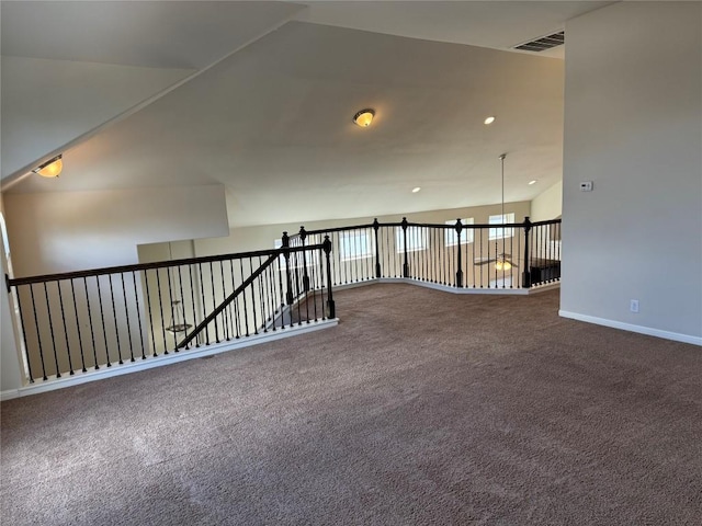 unfurnished room featuring baseboards, lofted ceiling, carpet flooring, and recessed lighting