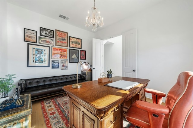 office area featuring dark hardwood / wood-style flooring and a notable chandelier