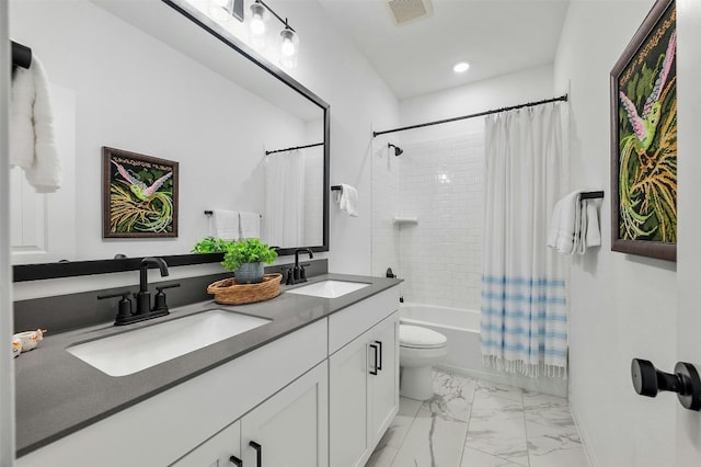 full bathroom featuring vanity, toilet, and shower / bath combo with shower curtain