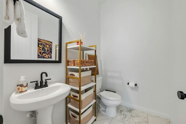 bathroom with sink and toilet