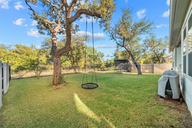 view of yard featuring a trampoline