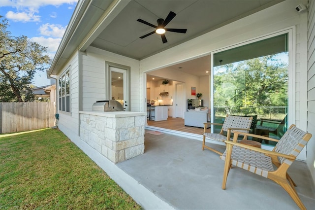 view of patio / terrace featuring area for grilling and ceiling fan