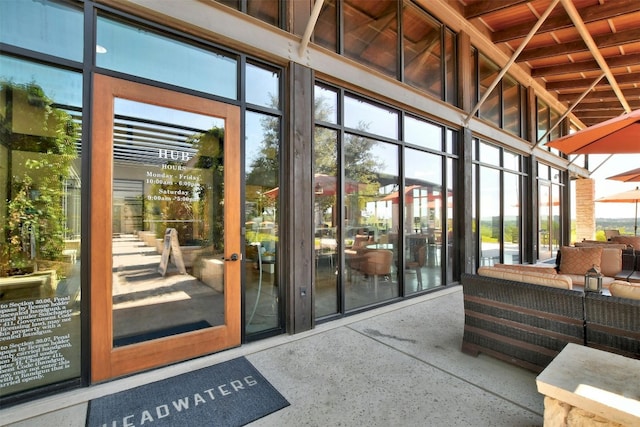 doorway to property with an outdoor living space