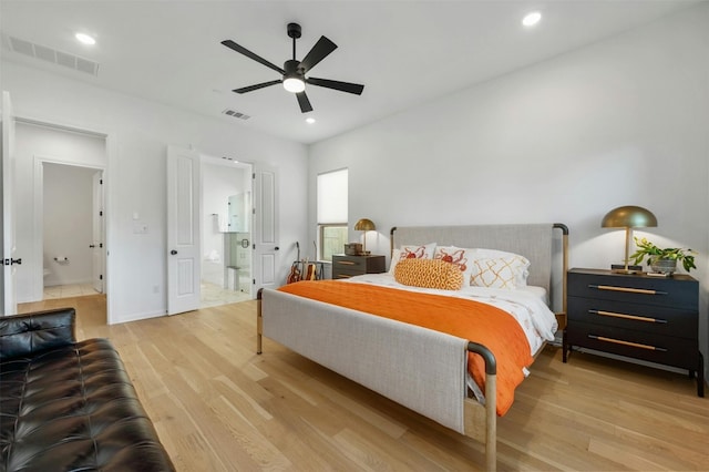 bedroom featuring ensuite bath, ceiling fan, and light hardwood / wood-style floors