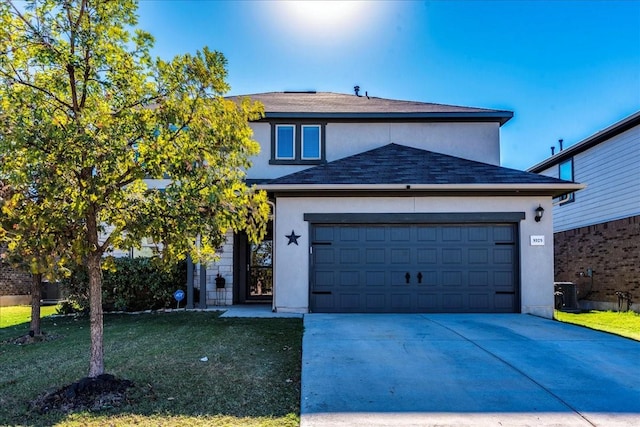 view of front facade featuring a front lawn and a garage