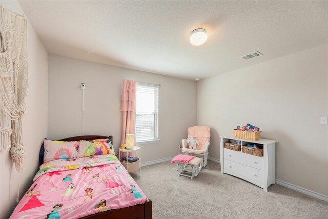 bedroom featuring light colored carpet