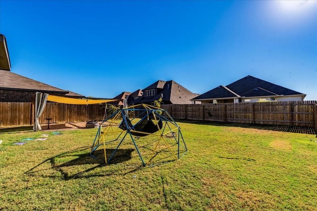 3925 Lyndsey Marie Ln, Pflugerville, TX 78660 - view of jungle gym with a lawn and a fenced backyard