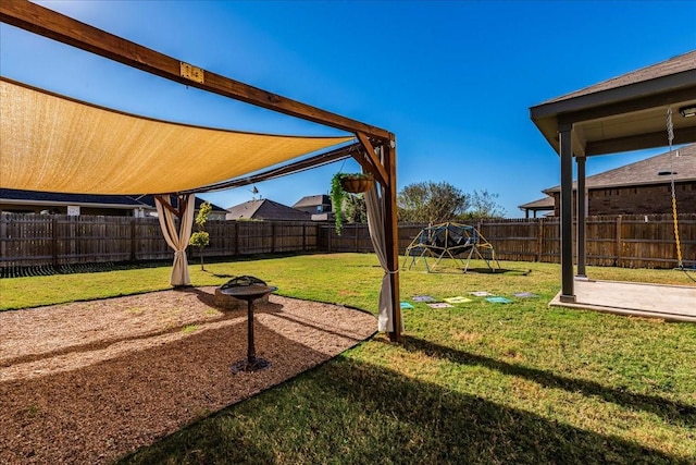 view of yard with a patio area and a playground