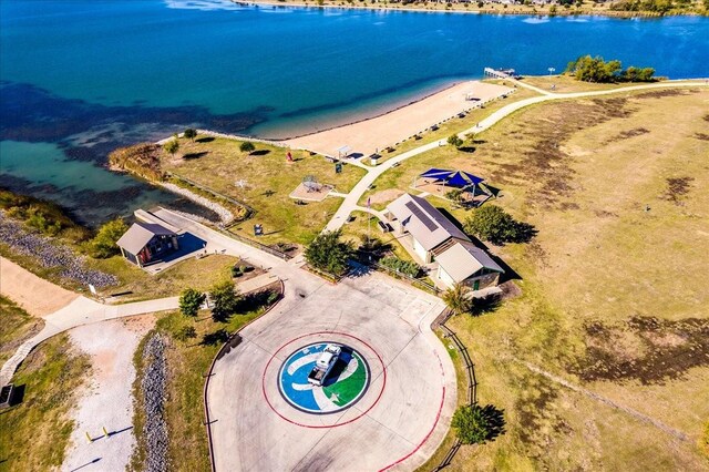 birds eye view of property with a view of the beach and a water view