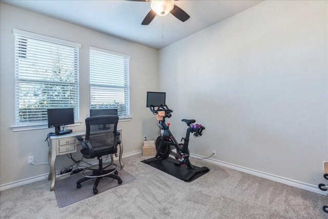 office area featuring ceiling fan and light carpet