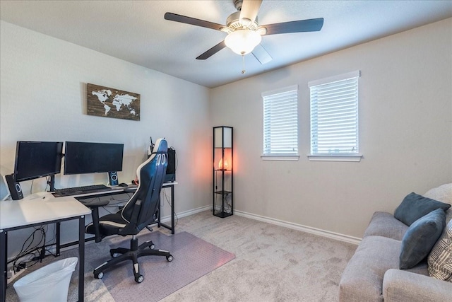 office with light carpet and ceiling fan