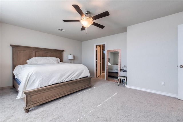 bedroom featuring light colored carpet and ceiling fan