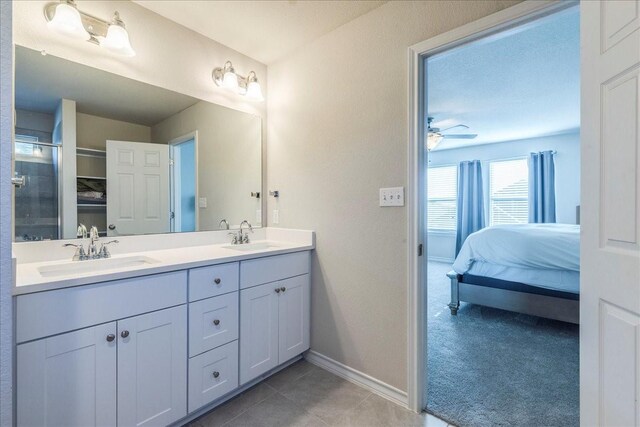 bathroom featuring vanity, tile patterned flooring, ceiling fan, and a shower with shower door