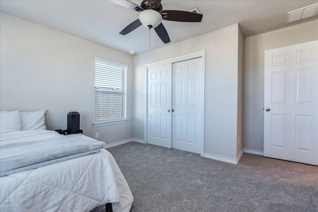 bedroom with ceiling fan, a closet, and carpet