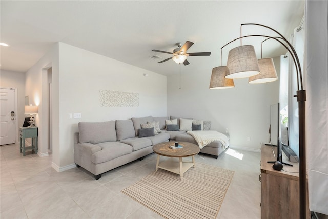 3925 Lyndsey Marie Ln, Pflugerville, TX 78660 - living room with a ceiling fan, baseboards, and light tile patterned floors