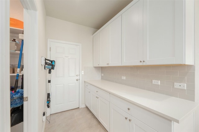 3925 Lyndsey Marie Ln, Pflugerville, TX 78660 - clothes washing area with light tile patterned floors