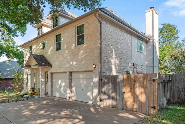 view of property exterior with a garage