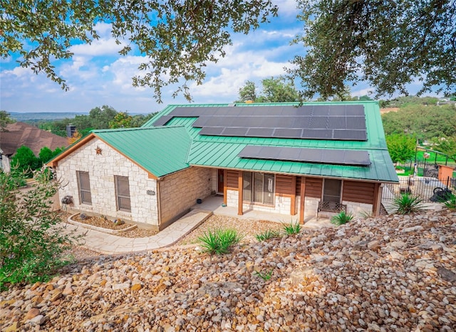 view of front of home with solar panels