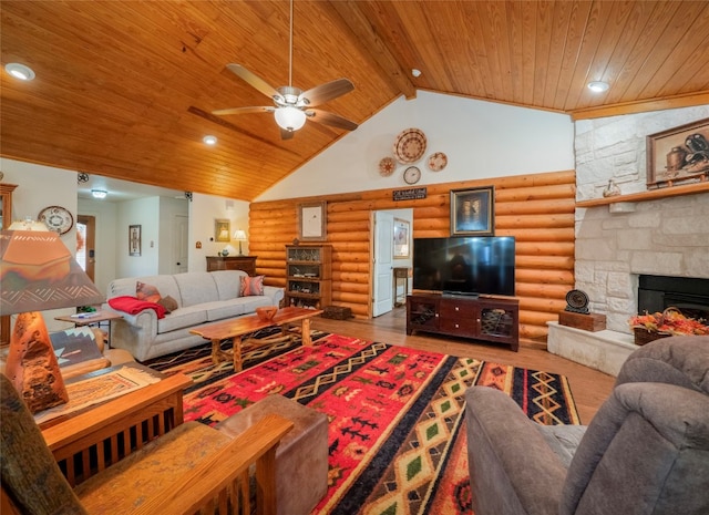 living room featuring wood ceiling, hardwood / wood-style flooring, rustic walls, high vaulted ceiling, and a fireplace