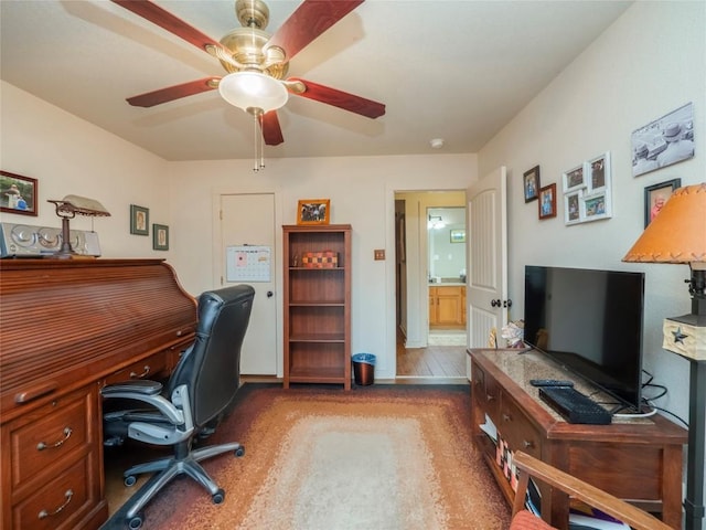 home office featuring ceiling fan and hardwood / wood-style floors